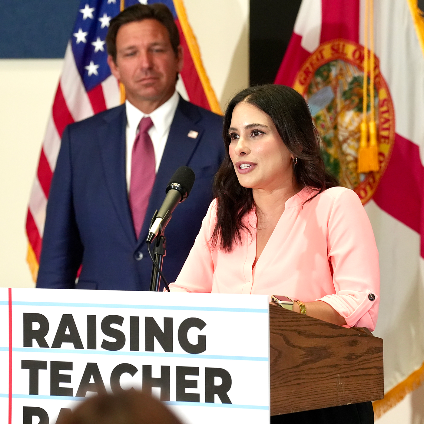 Ron Desantis with woman at press conference